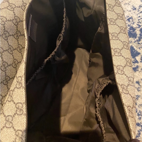 GG Supreme canvas diaper bag with multiple pockets and fold-out changing mat. - Picture 4 of 5